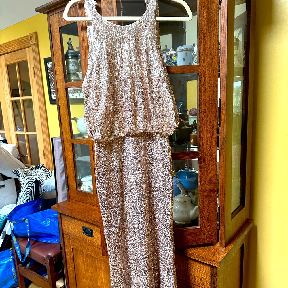 Pre-loved from Rent the Runway. Size 8 Badgley Mischka rose gold maxi gown.